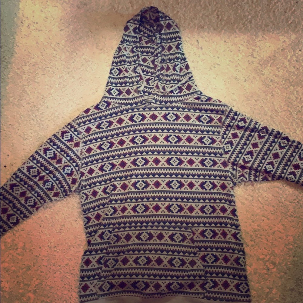 Gray, red, black, and blue tribal pattern hoodie.